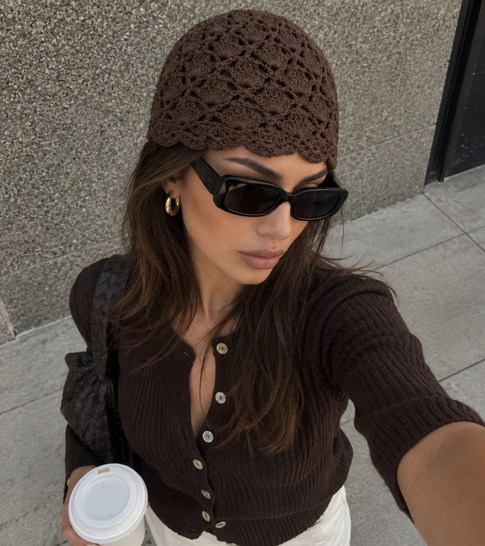 Dark brown openwork crochet beanie hat with scalloped lace pattern