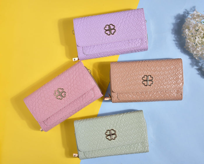 Set of four textured faux leather clutches with clover charms: purple, pink, beige, blue