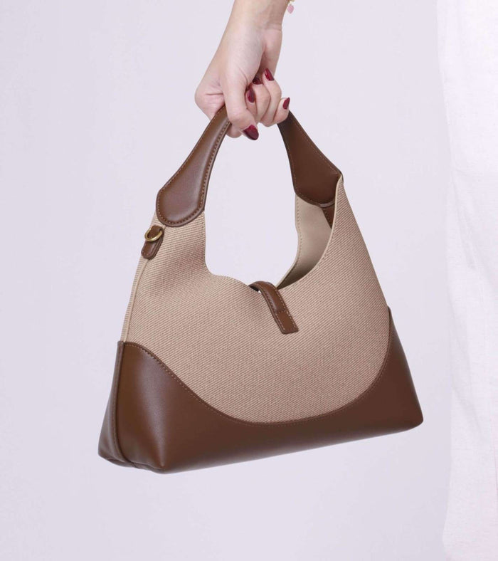 Beige tweed shoulder bag with brown leather bottom, loop handles, gold hardware
