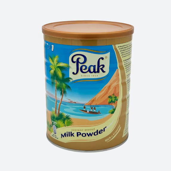 900g tin of Peak Dry Whole Milk powder, rich and creamy full cream milk for drinking, cooking, and baking.