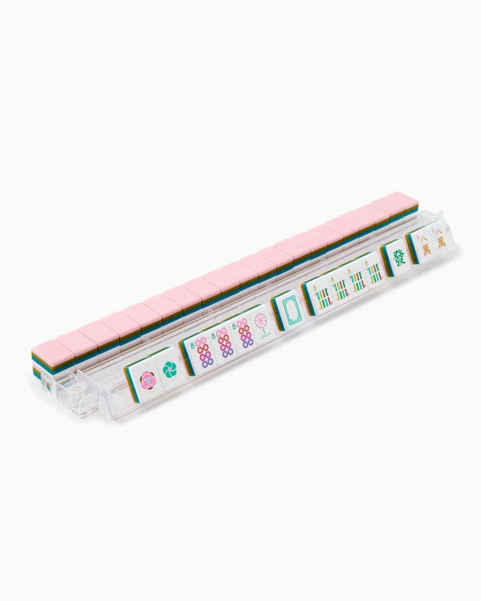Acrylic mahjong tile rack with white tiles featuring colorful designs and pink ends.
