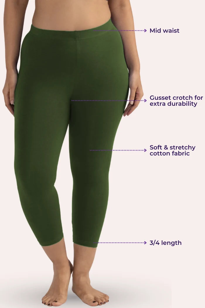 Green cropped leggings with text labels on a white background