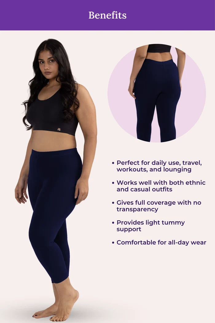 Woman wearing navy blue leggings with product benefits listed on a white background