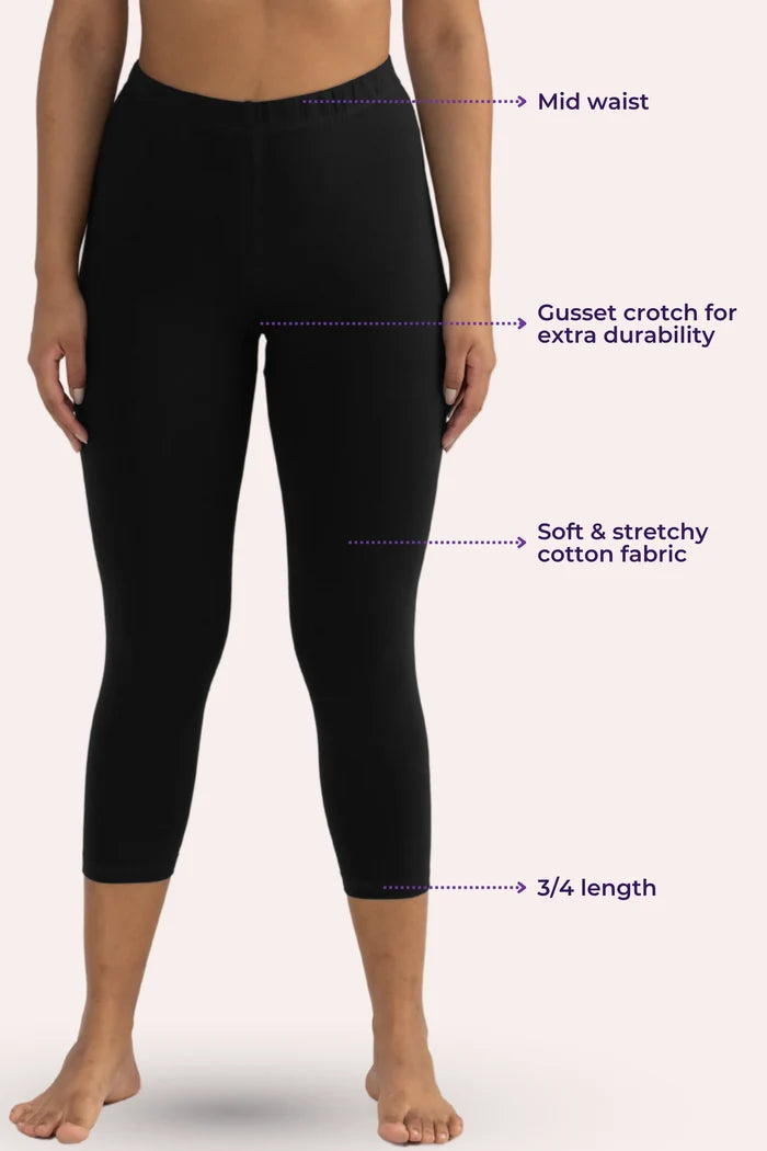 Black cropped leggings with text labels on a white background