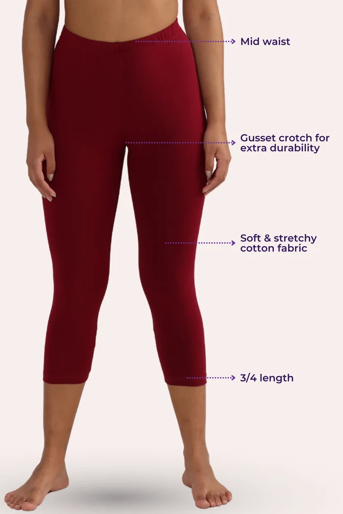 Maroon cropped leggings with text labels on a white background