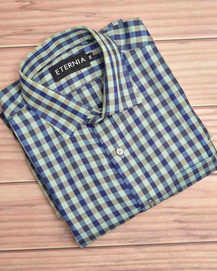 Men's linen shirt, blue and light green checkered pattern, folded with button placket