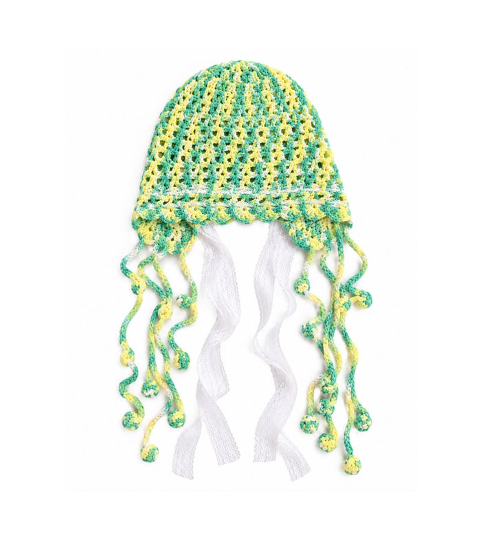 Green and yellow crochet cap with lace edge and long tassel ties