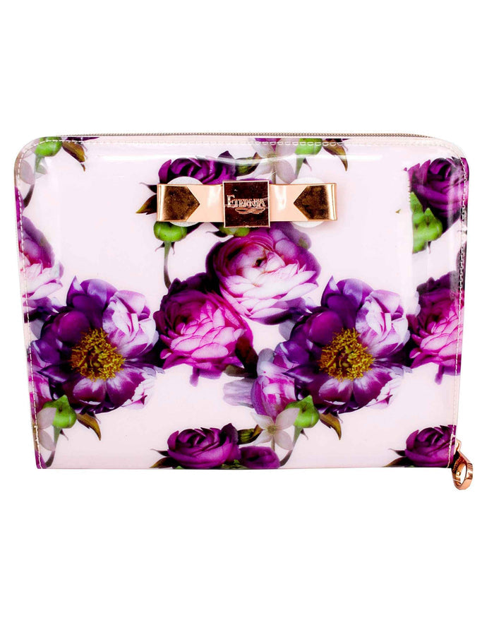Light pink tablet carry bag with purple floral print, centered gold bow clasp, and zipper