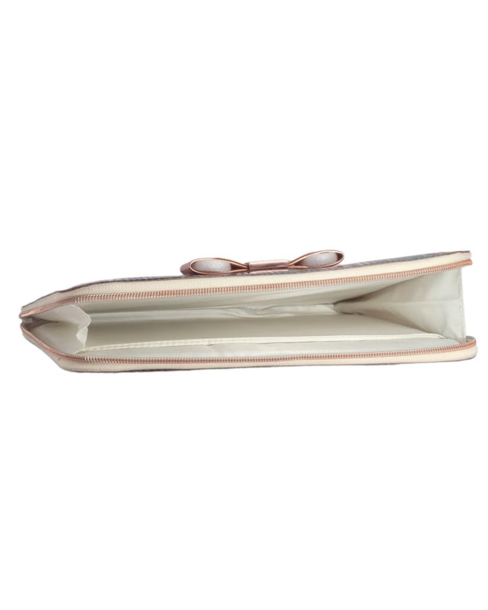 Light pink tablet carry bag interior with beige lining and gold zipper opening