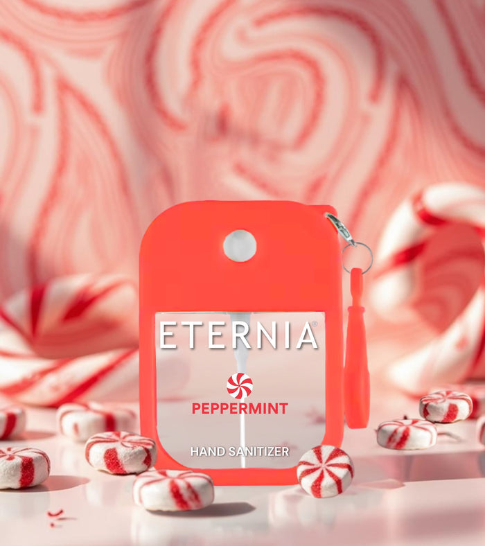Red ETERNIA PEPPERMINT hand sanitizer with keyring near candy canes
