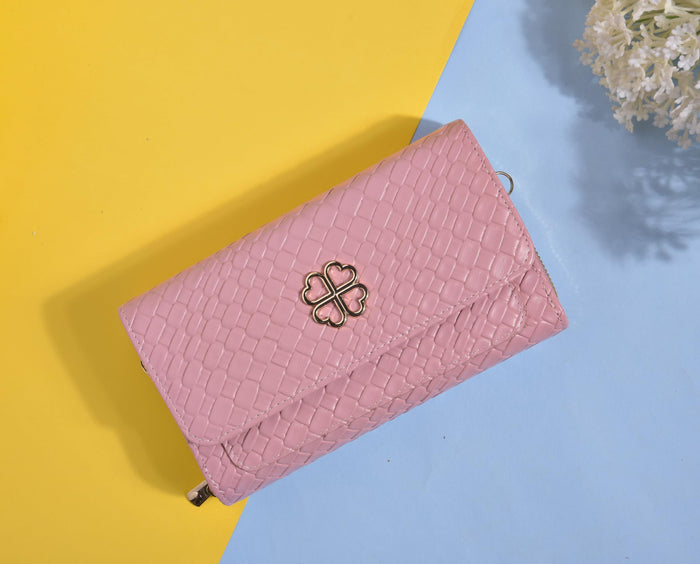 Pink embossed faux leather crossbody wallet clutch, clover charm on front flap.