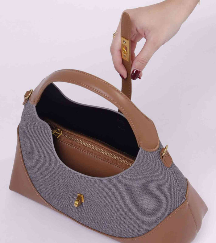 Grey tweed bag with open top, tan leather interior and gold zipper pull