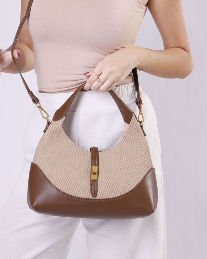 Beige tweed shoulder bag with brown vegan leather base, front zipper, gold hardware