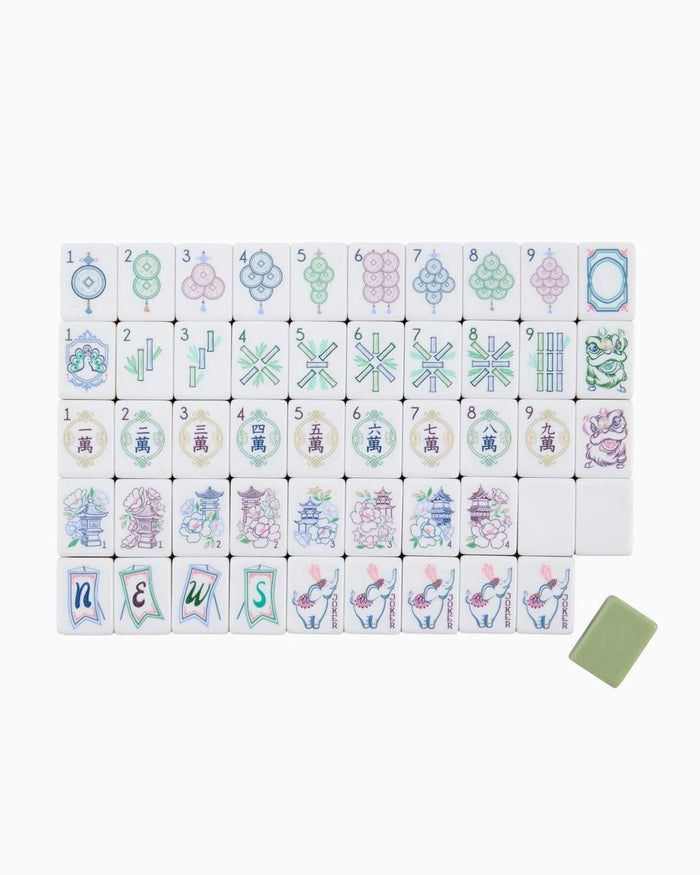 Acrylic mahjong tiles set with multiple white tiles showing colorful suit symbols in rows.