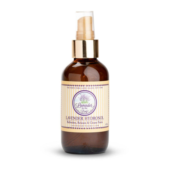 Lavender hydrosol sprayer bottle with Lavender By The Bay logo standing on white background