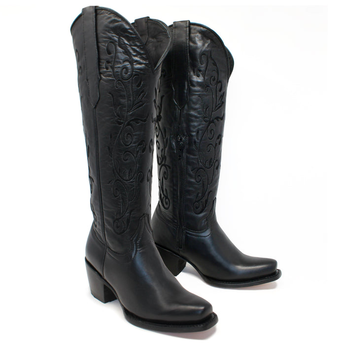 Pair of Artillero women’s black cowboy boots with 16 inch embroidered shaft, 2.5 inch heel, and snip toe design