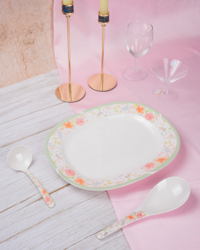 Oval melamine serving plate with white center and pastel floral border