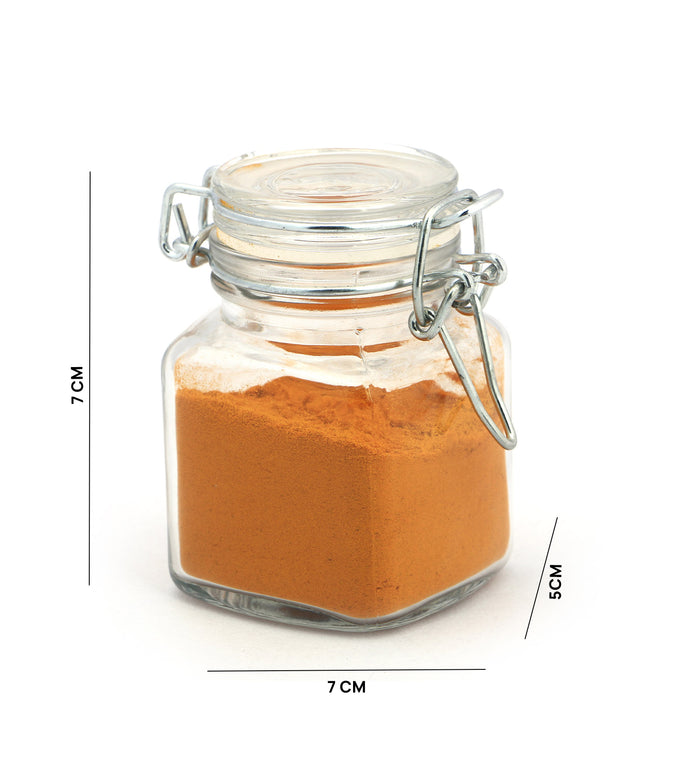 Airtight square glass jar with clip-top lid, filled with orange powder