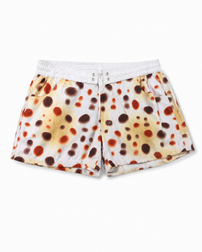 Boys' white swim shorts with brown/orange dot print and elastic waistband