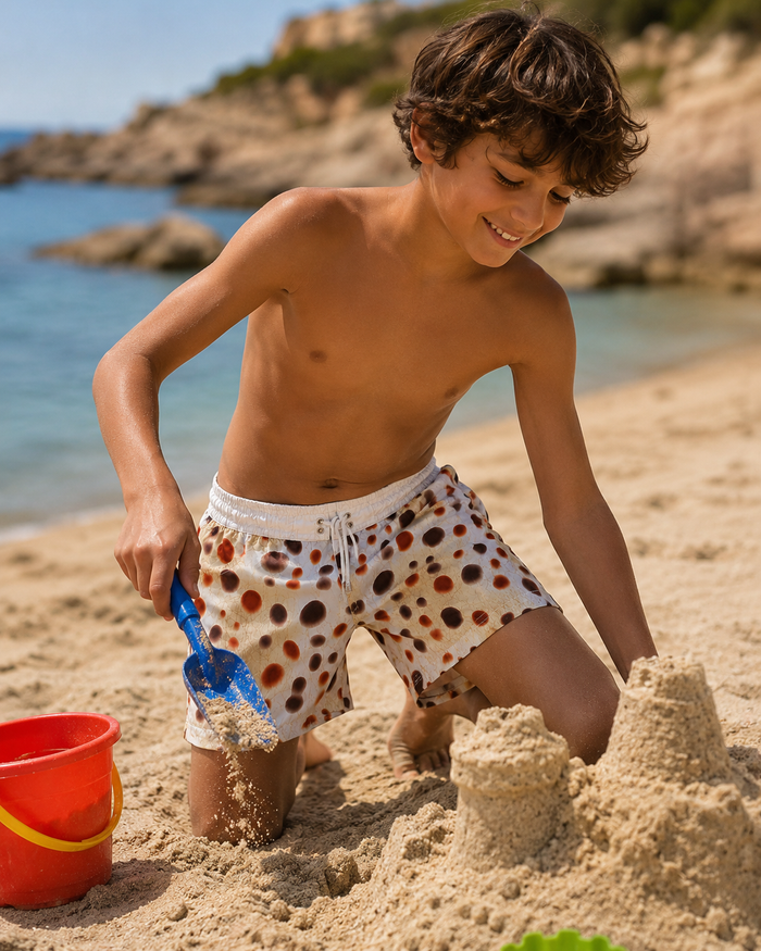 Boys' dot-print swim shorts with elastic waistband and white drawstring ties