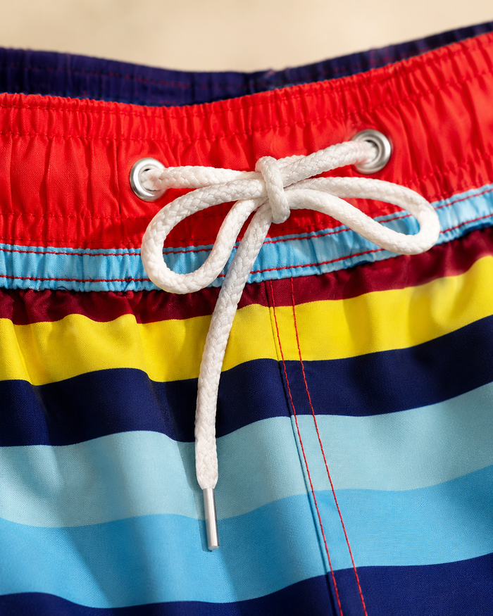 Boys striped swim shorts with elastic waistband and white drawstring tie