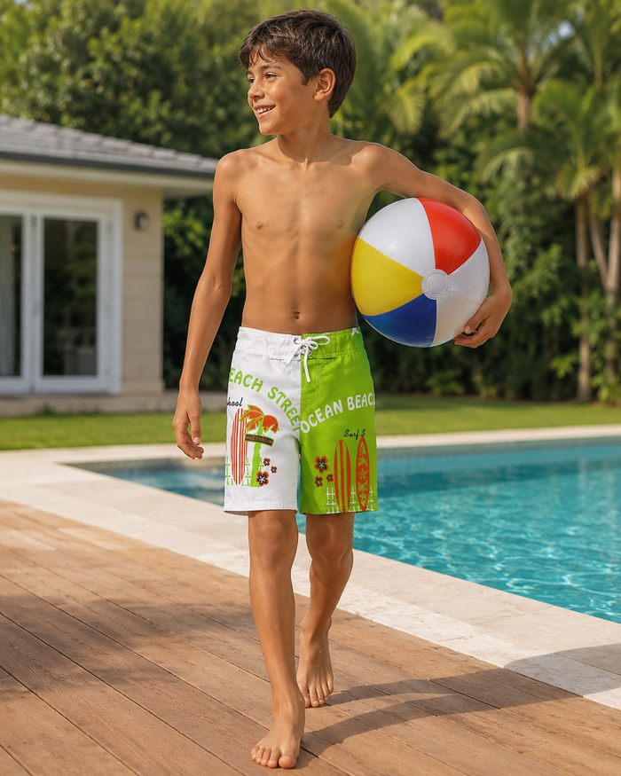 Boys' green and white swim shorts with colorful surf and beach graphic, drawstring tie
