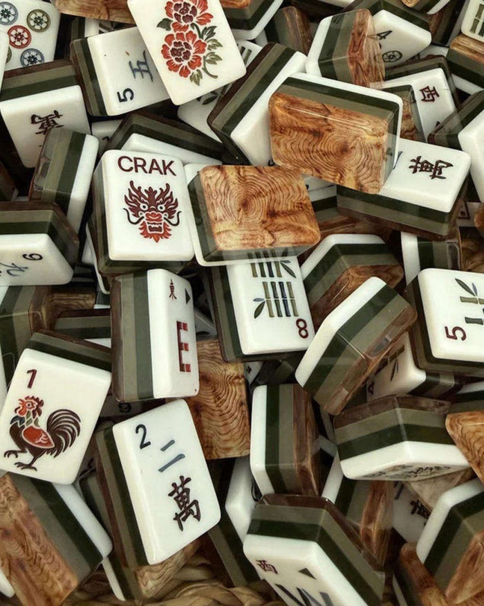 Acrylic mahjong tiles with white faces, wood-grain panels, and Chinese characters