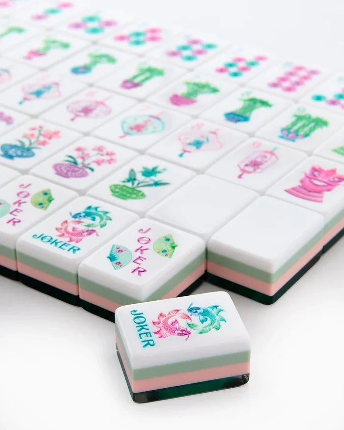 Stacked mahjong tiles with Joker tiles and floral pot symbols on white faces