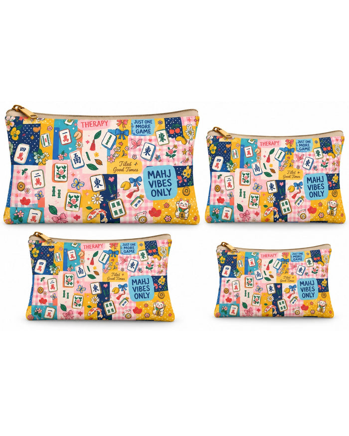 Set of four printed vegan leather zipper pouches with gold zipper pulls