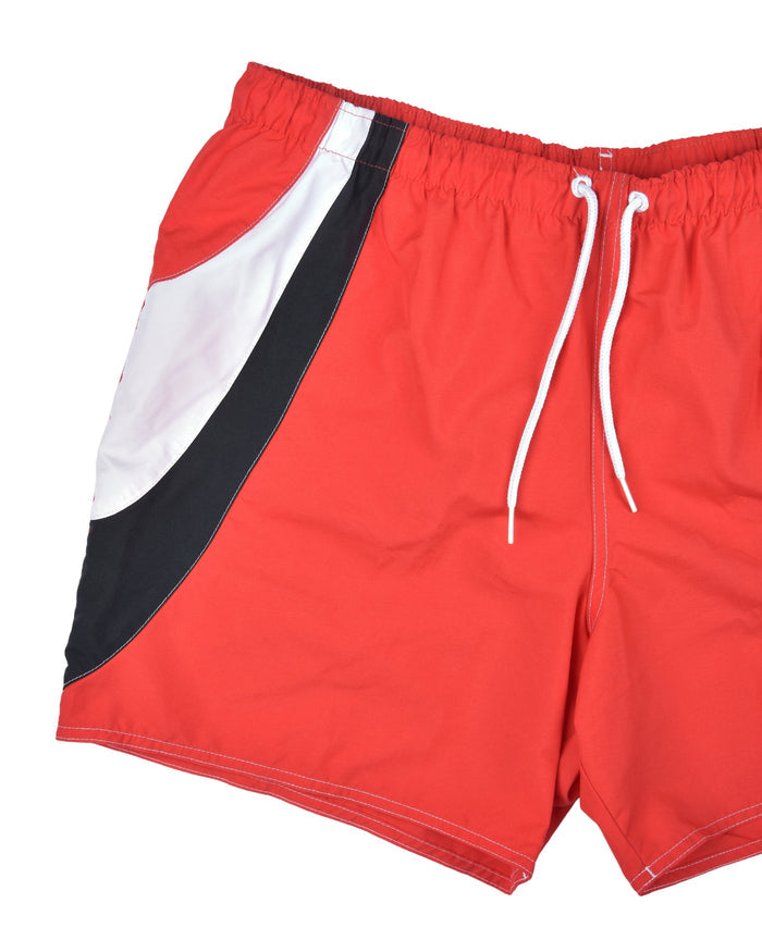Men's red swim shorts with angled black-and-white side panels and white drawstring