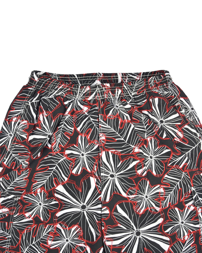 Men's swim shorts close-up of floral print; elastic waistband and drawstring