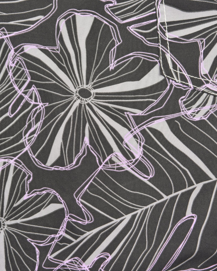Men’s swim shorts fabric close-up, dark with white and purple floral line pattern