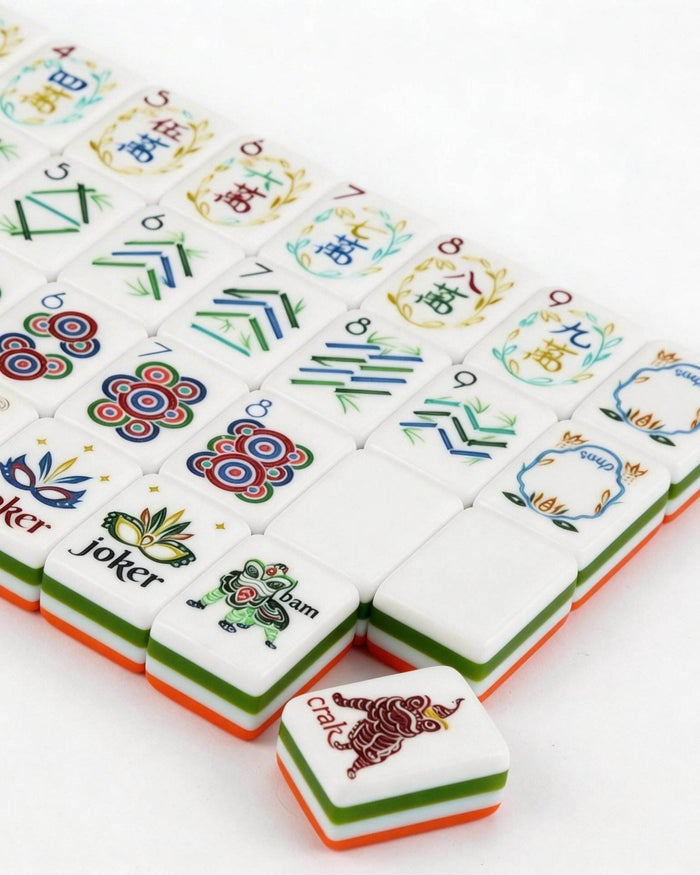 Laid-out melamine mahjong tiles with orange borders, joker tile, and illustrated characters