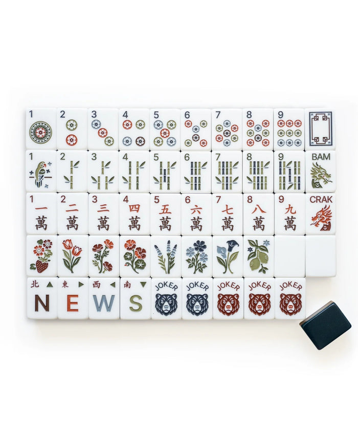 Acrylic mahjong tiles set showing bamboo, numbers, and character tiles