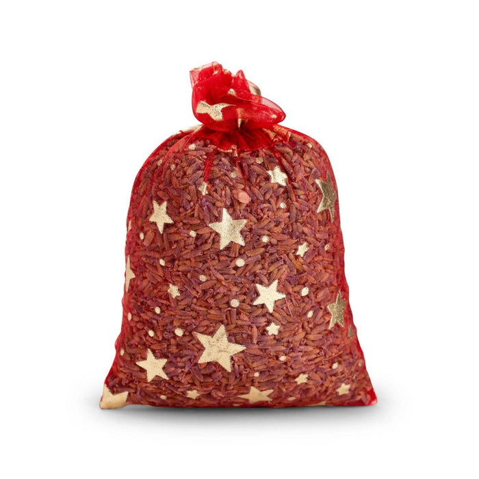 A red organza lavender sachet for moth with gold stars on white background