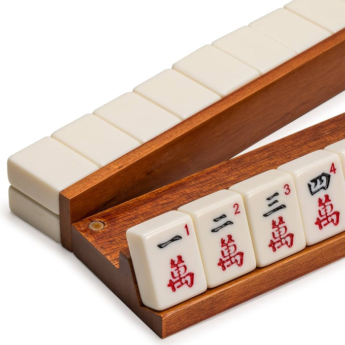 Dark brown wooden mahjong rack with four white tiles, red and black characters